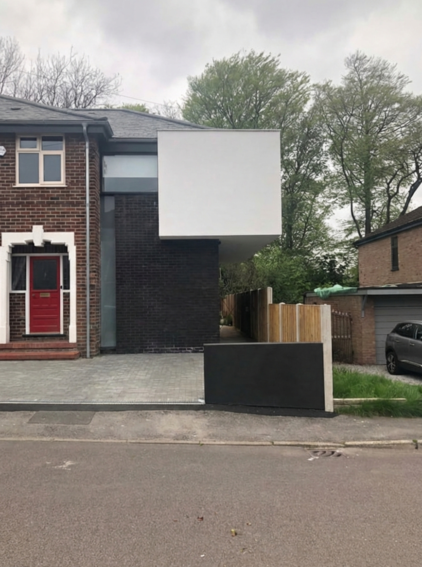 Front elevation with cantilevered white volume