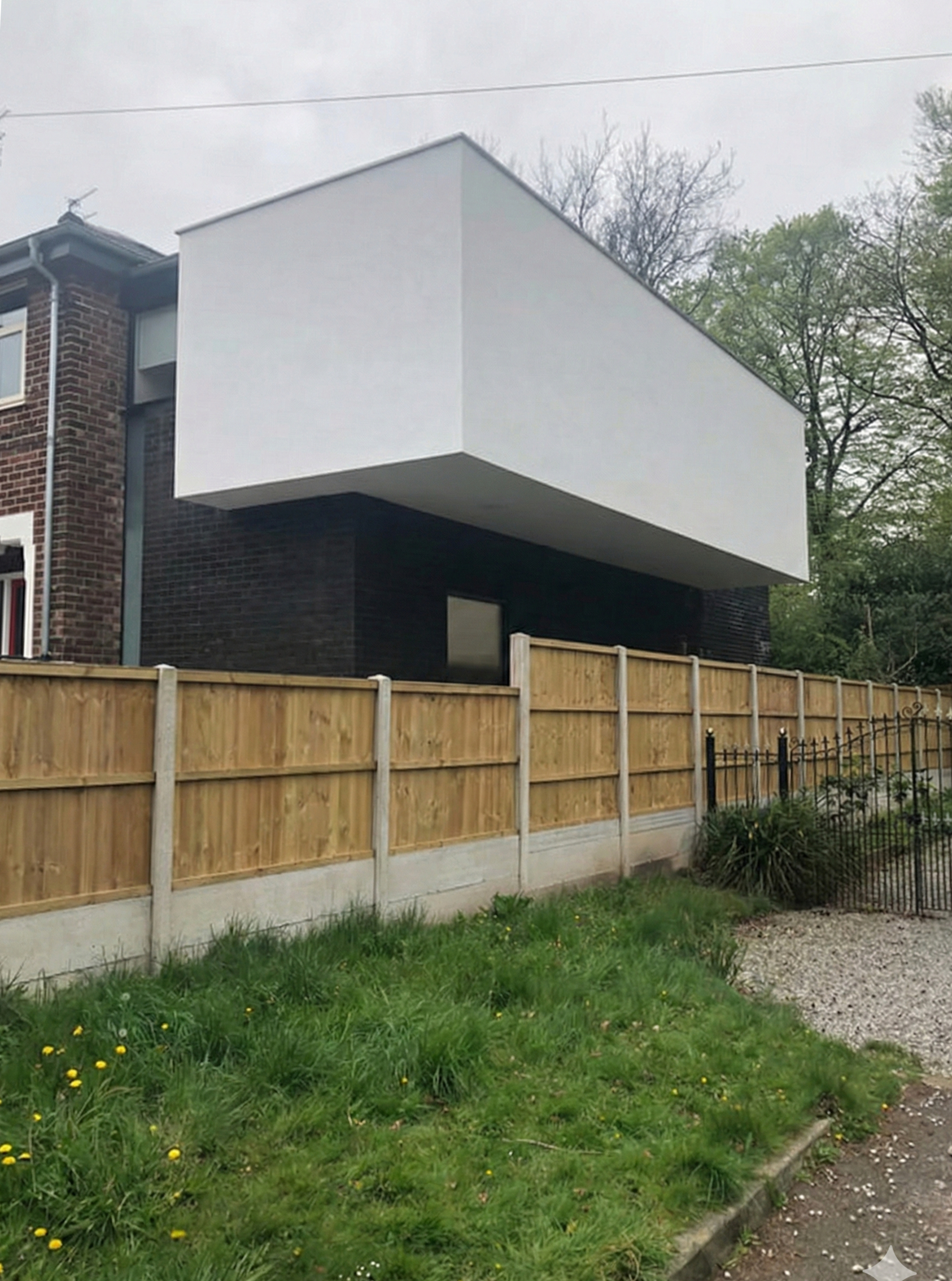 Side view of cantilevered extension over dark brick base