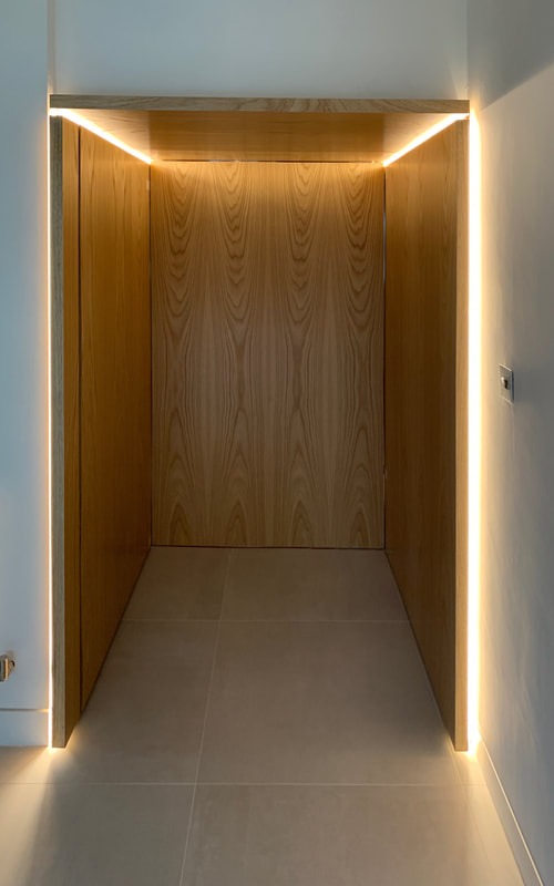 Oak-lined concealed door detail with light reveal