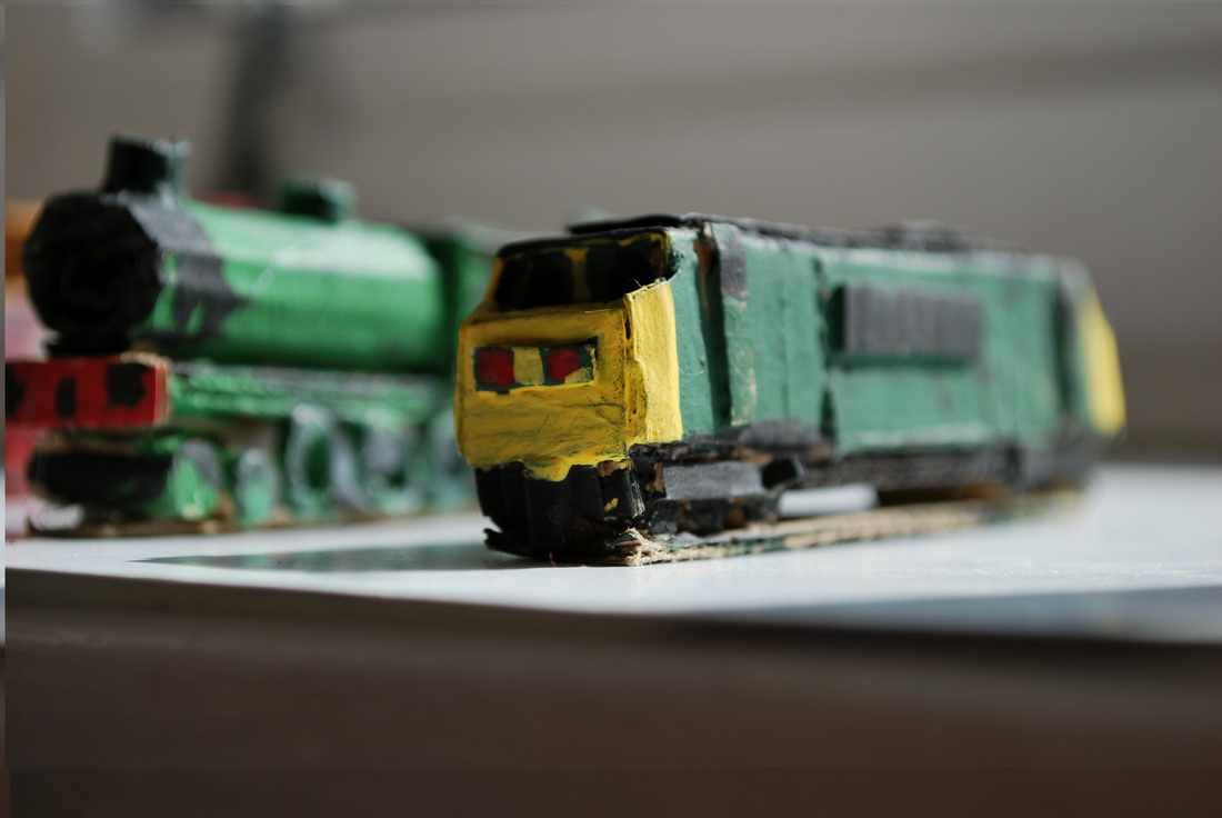 Handmade green diesel and steam locomotives