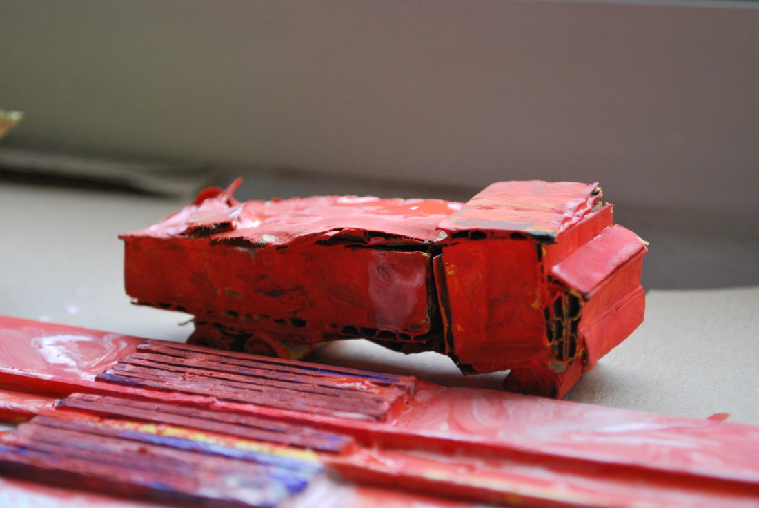 Handmade red car with painted track
