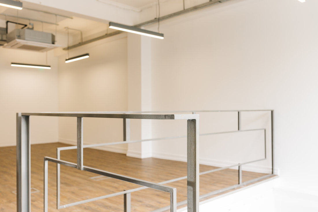 Detail shot of the welded raw steel handrail