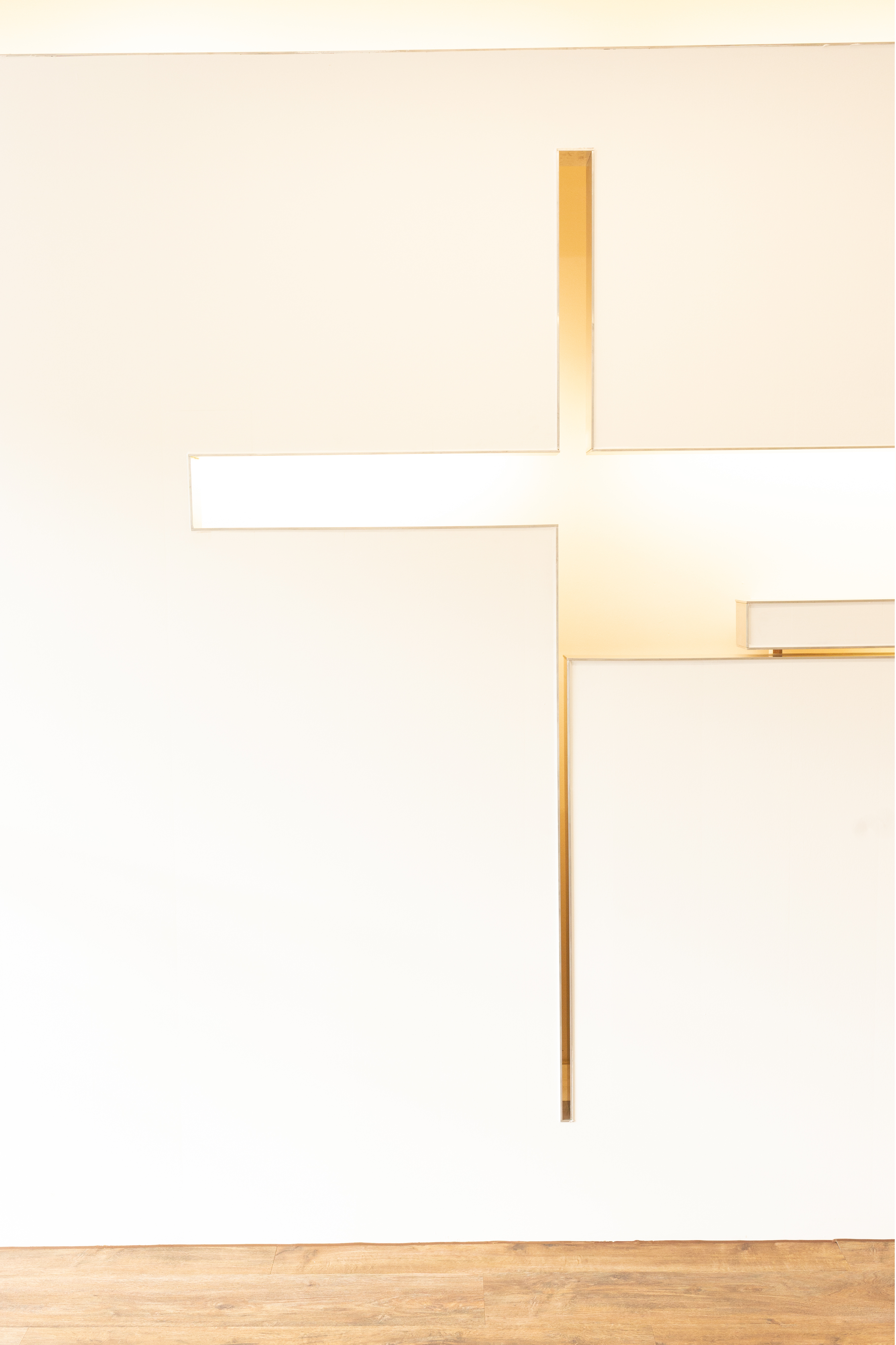 Close up detail of the glowing geometric cross wall feature
