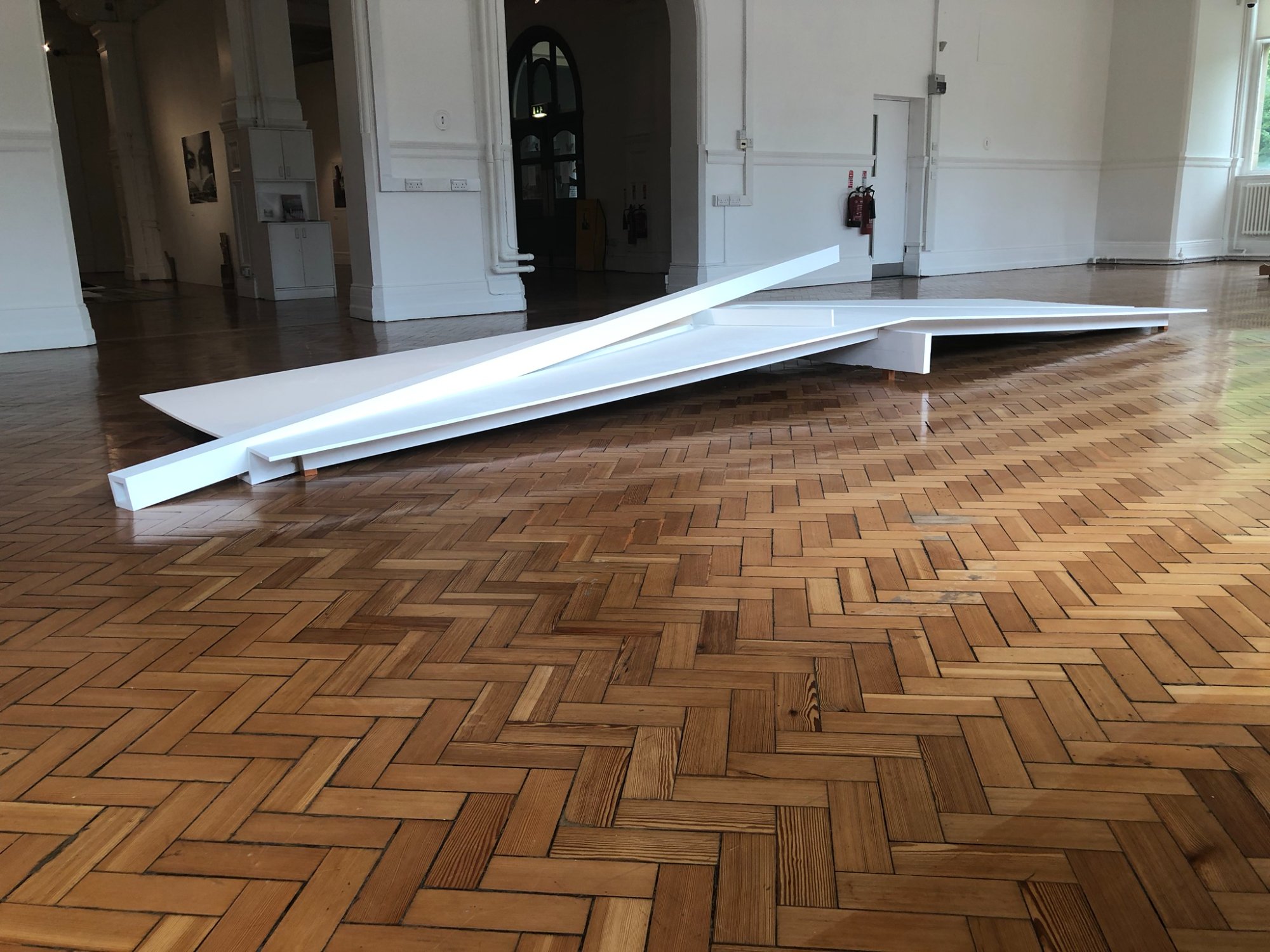 White sculpture in gallery