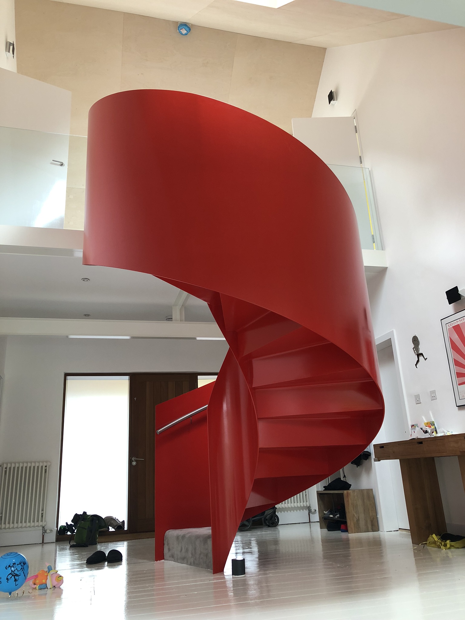 Close up view of the sweeping red steel staircase