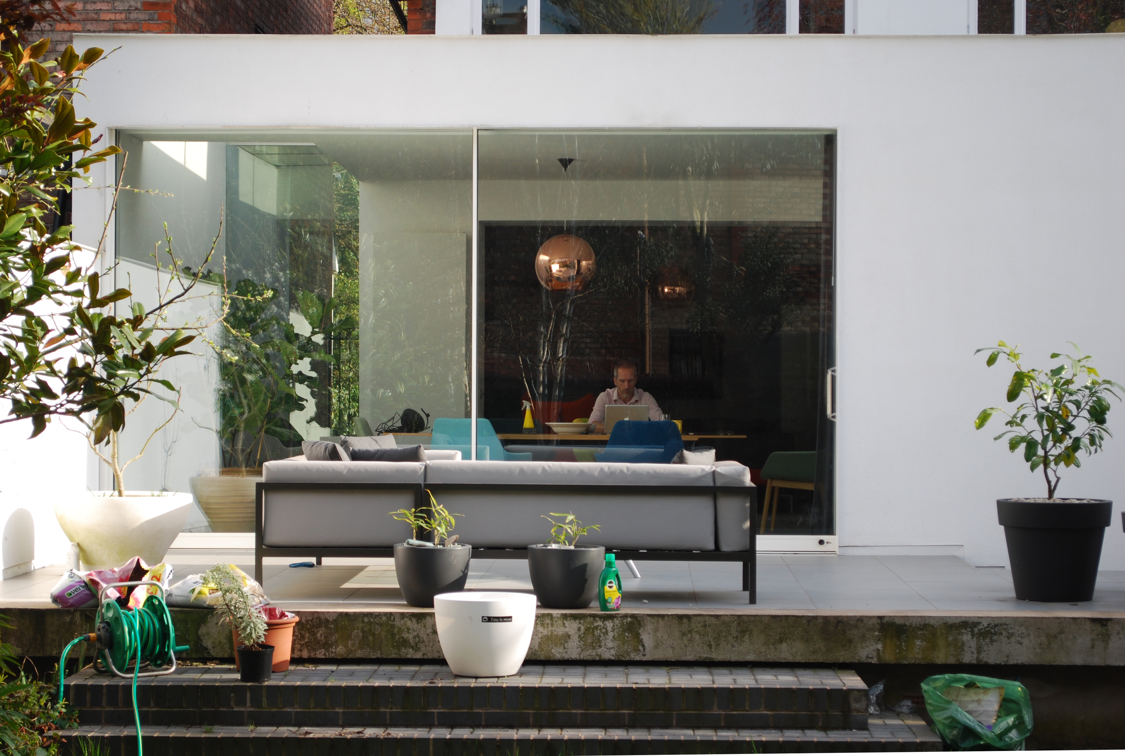 View from the garden looking into the bright modern kitchen extension